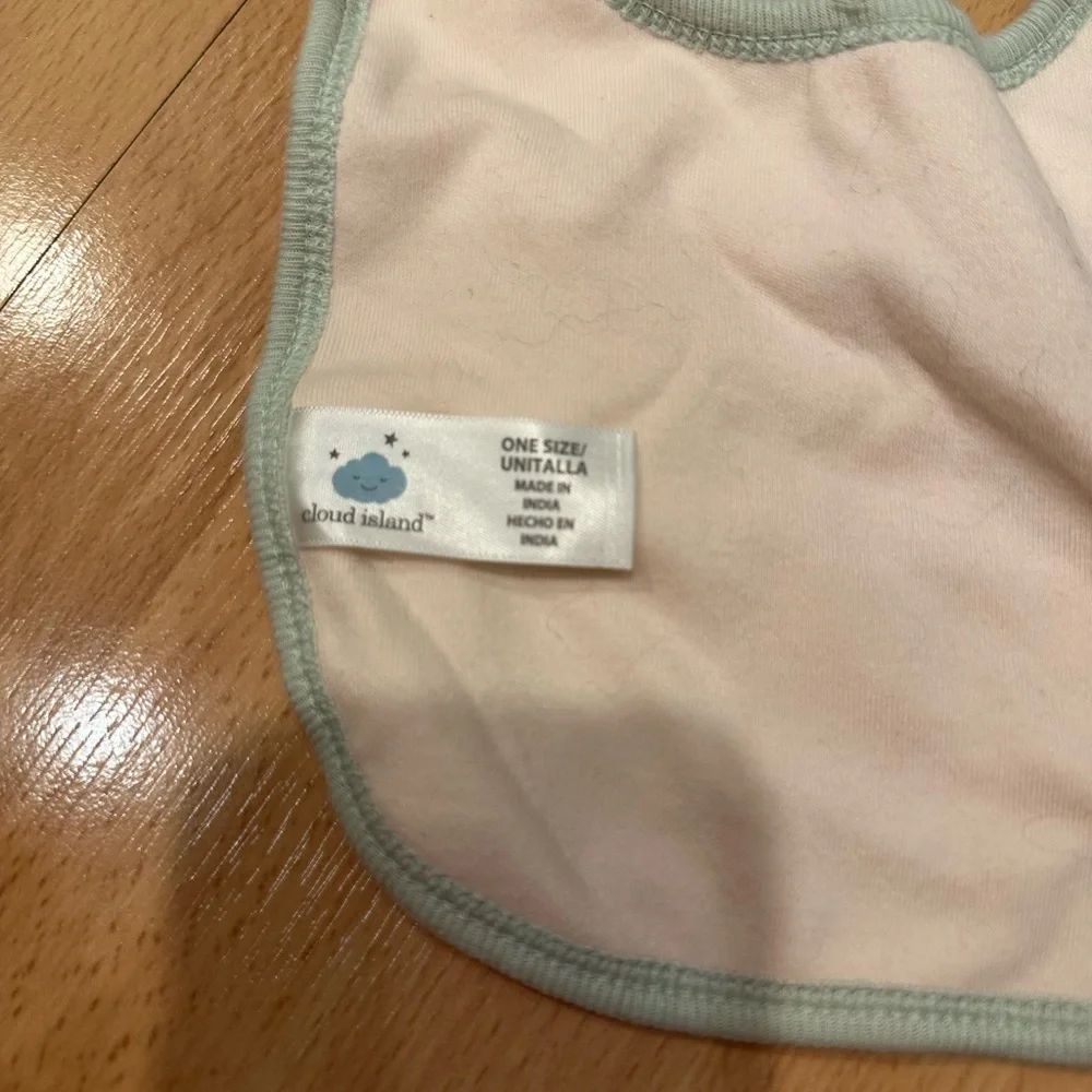 Set of four girls patterned cloud island bibs